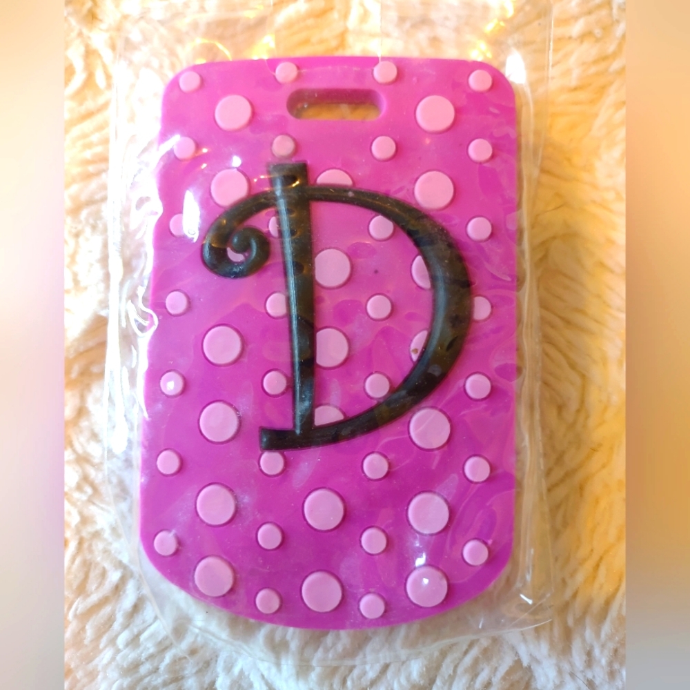 Luggage Tag. Pink polka dot design with the initial "D".